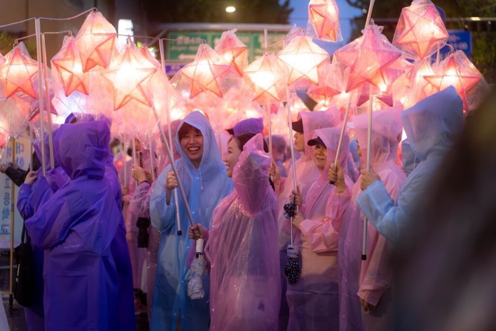a group of people in raincoats holding umbrellas