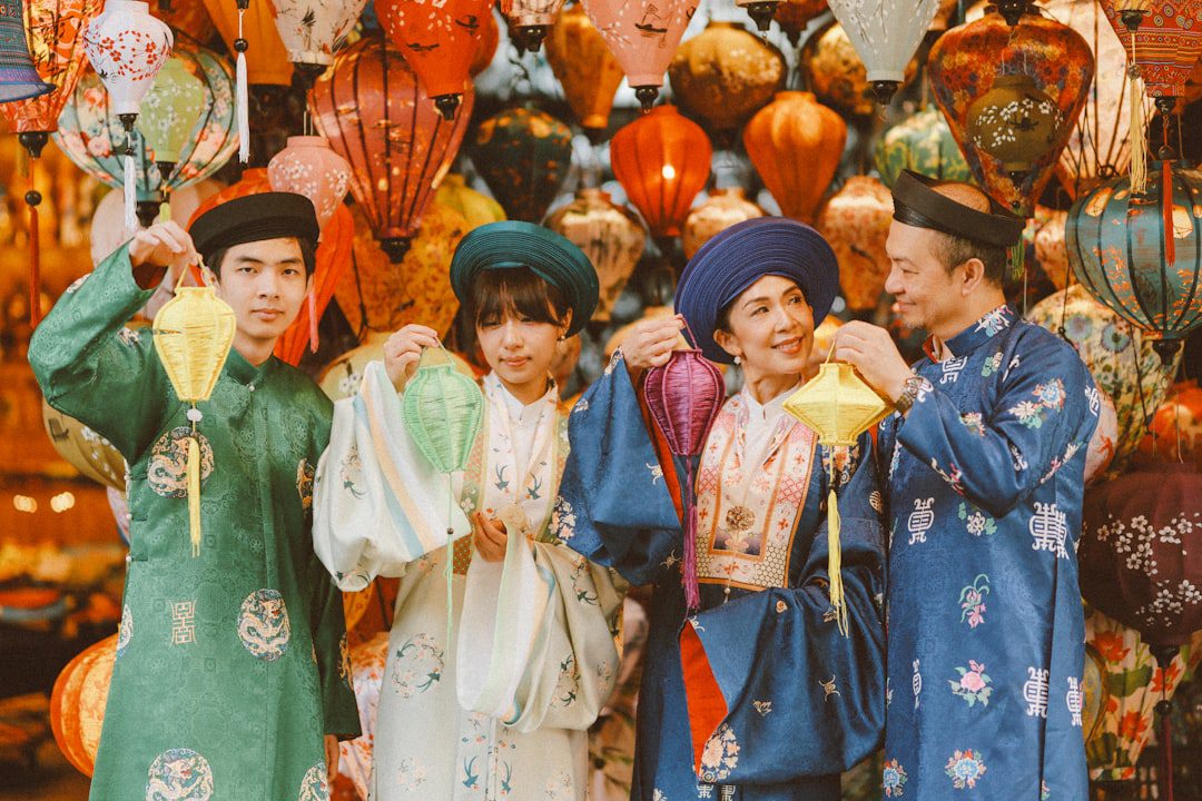 Family in traditional clothing holding lanterns