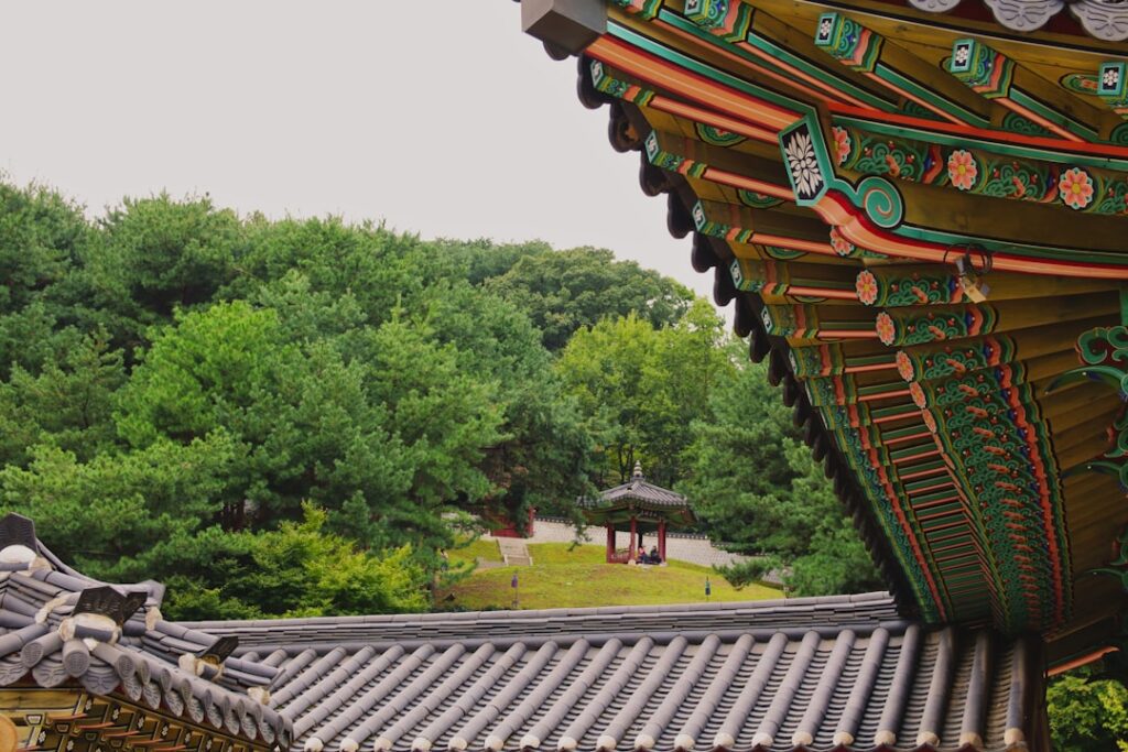 Traditional korean temple roof with forest background