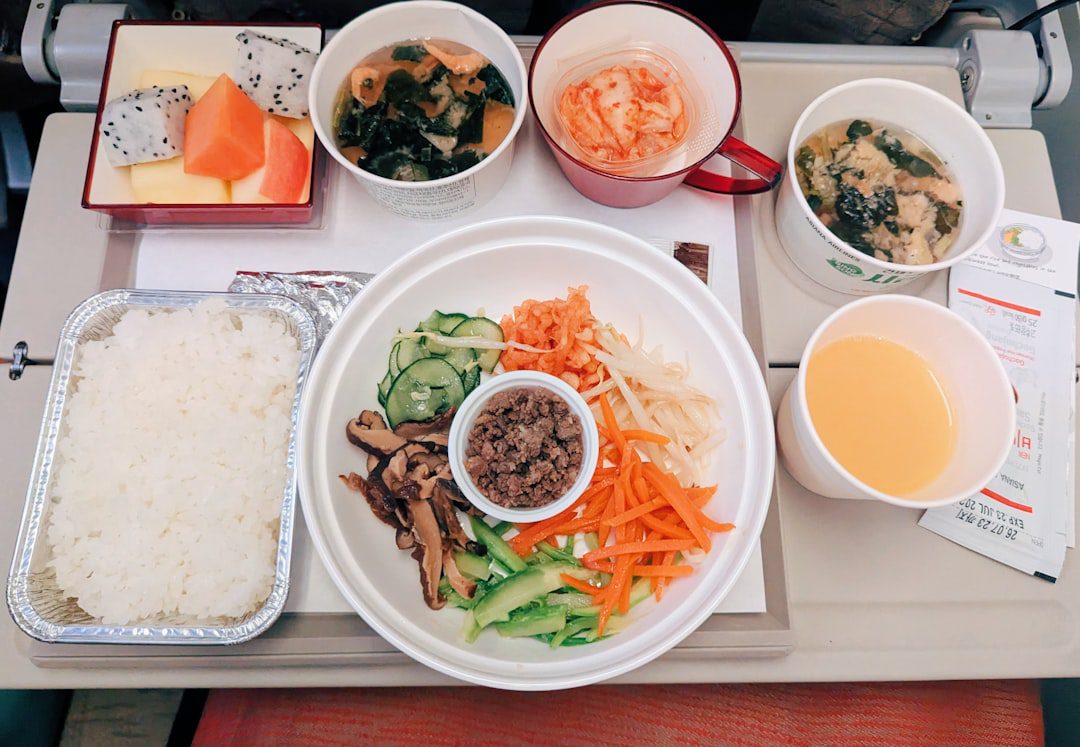 Korean meal with bibimbap, rice, soup, and side dishes